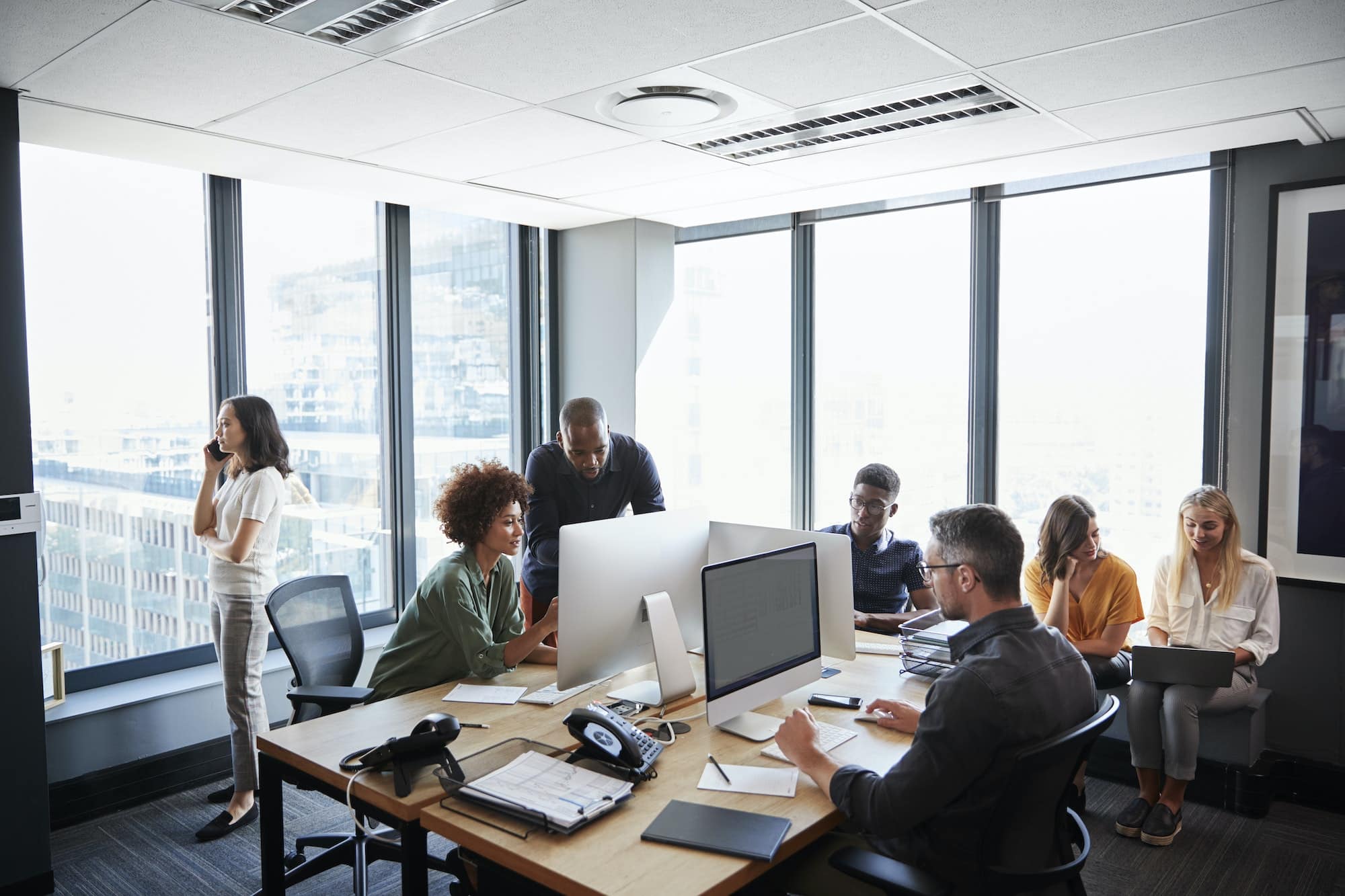 Creative business team working together in a busy casual office